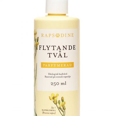 250 ml Flytande tvål utan pump i ljusgul förpackning. Cylinderformad med vitt lock. Parfymerad. Rapsblommor i gul färg målade. Rapsodine i gul text överst på förpackning.