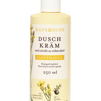 250 ml Dushkräm i ljusgul förpackning. Cylinderformad med vitt lock. Parfymerad. Rapsblommor i gul färg och blå enbär målade. Rapsodine i gul text överst på förpackning.